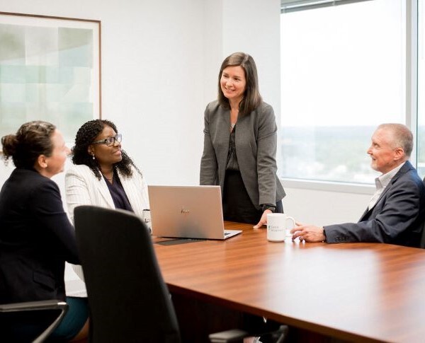 A team of attorneys meeting together