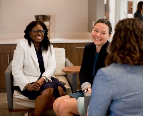 Attorneys talking together in an office setting