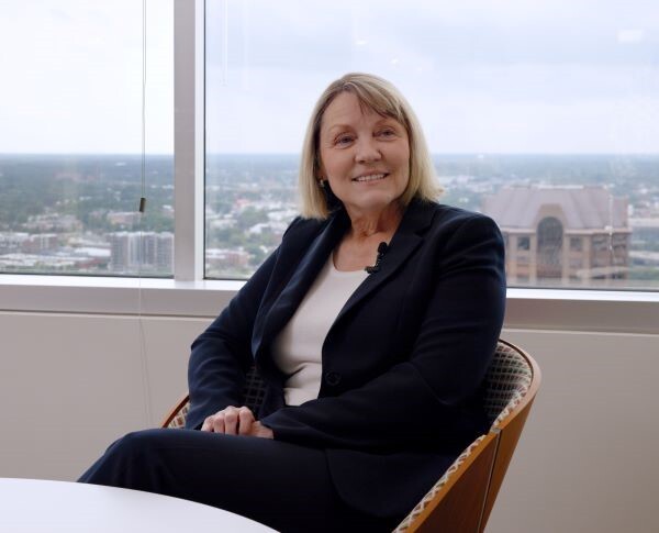 A woman talking to the camera about work life balance at Sands Anderson